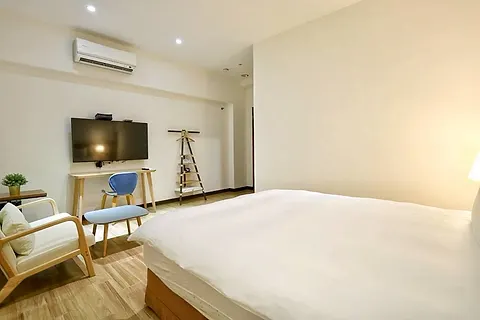 Double room with marble ensuite, work desk, and armchair